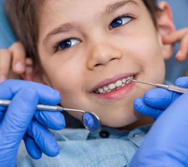 little boy for come for the additional dental procedures