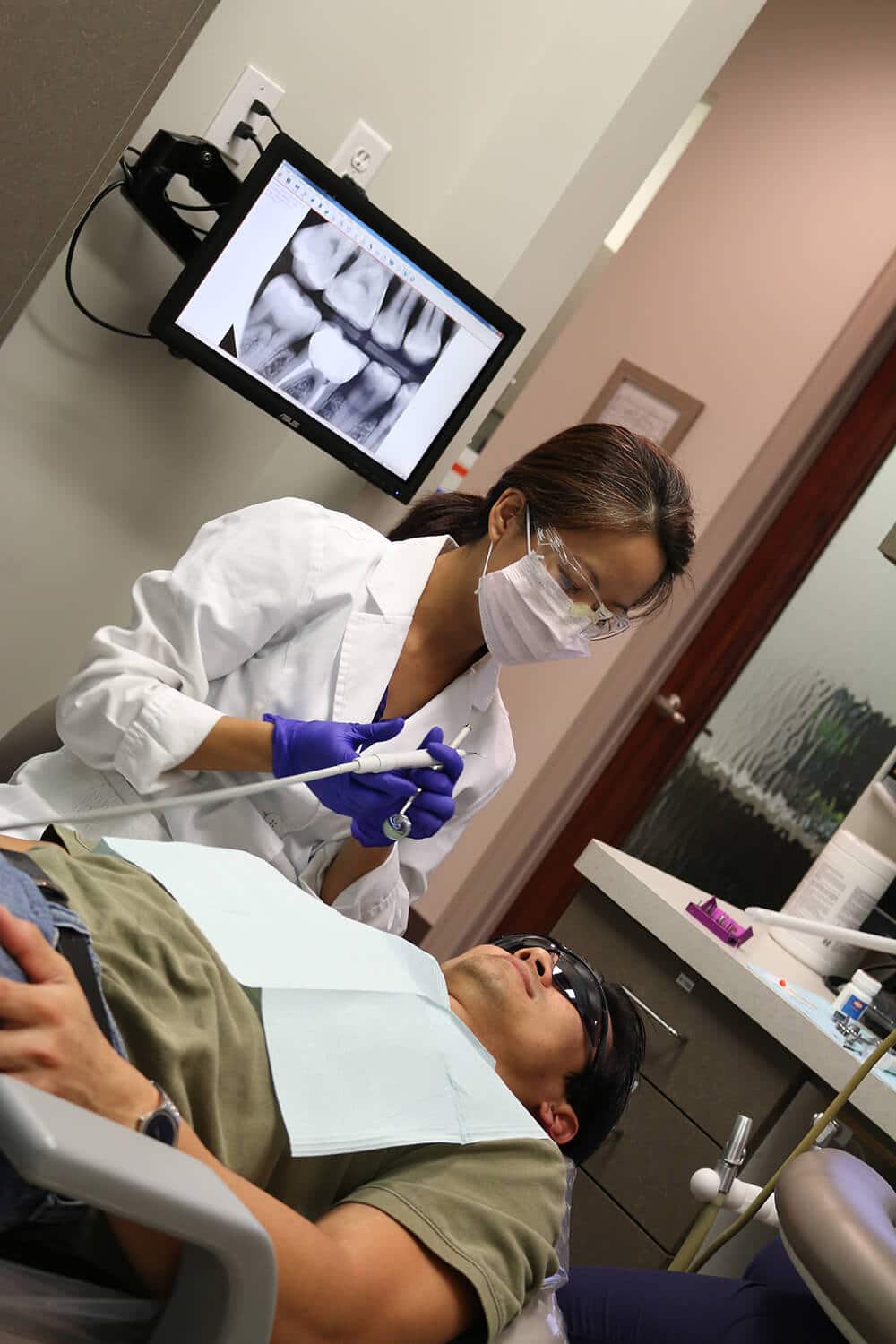 Patient lying in a dental chair during a dental procedure